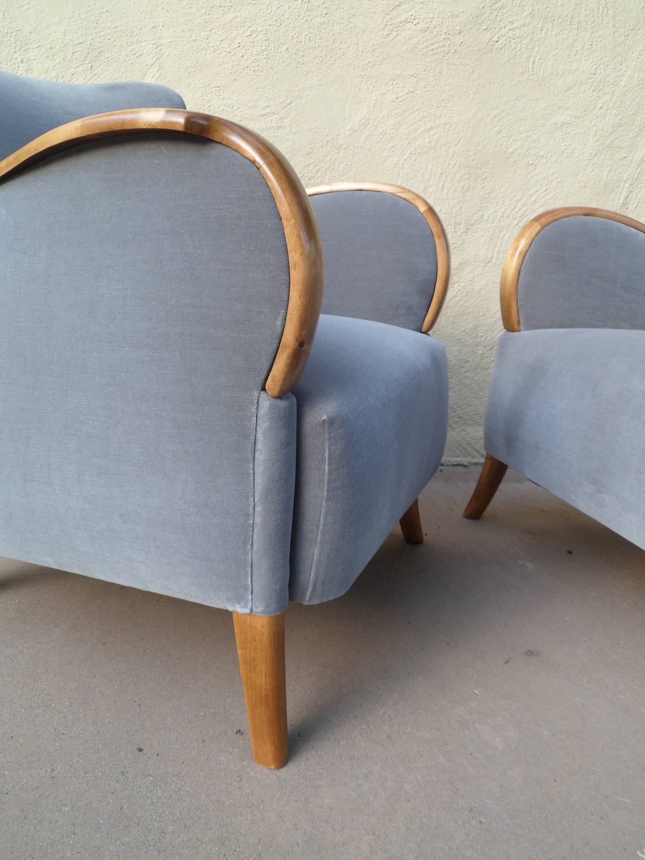 Pair of Swedish Art Deco Armchairs in Golden Birch Wood and Gray Velvet. Wood had been completely restored by our woodworkers. Freshly reupholstered in gray velvet. A sculptural, comfortable pair of chairs in a smaller scale. Made in Sweden ca.
