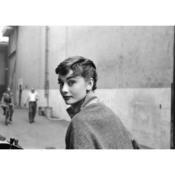 Captured by Mark Shaw for a LIFE magazine article in 1953 is a portrait of Audrey Hepburn on the back lot of 