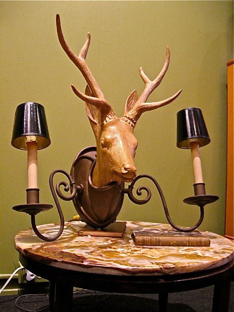 Ceramic and copper deer sconce. Antlers are metal covered with ceramic material. Sconce is illuminated from the back as well as wired candles at either side. Originally purchased at Gumps in San Francisco in the 1960's.

The price listed is the