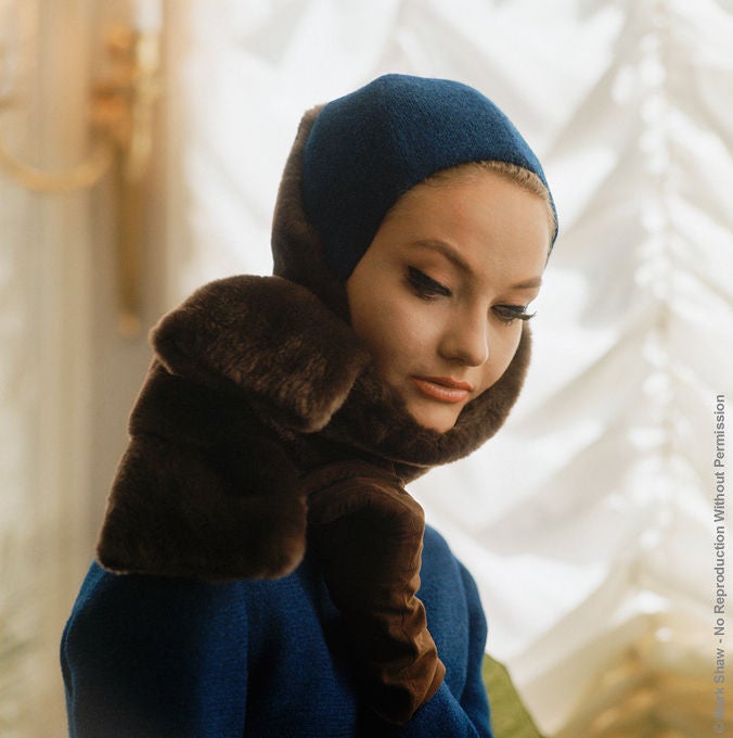 Shot is Paris in 1961 by legendary photographer Mark Shaw is a model wearing a blue Nina Ricci hood and mink scarf. This image is an outtake taken by Shaw for a LIFE Magazine about Parisian fashion of that year. This work is available exclusively