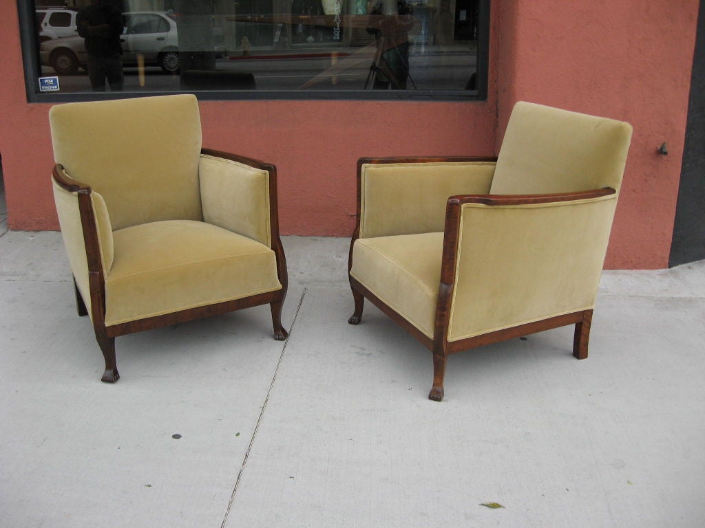 Pair of Swedish art deco/art moderne armchairs/bergeres in highly figured flame birch. Restored and reupholstered in tan velvet.