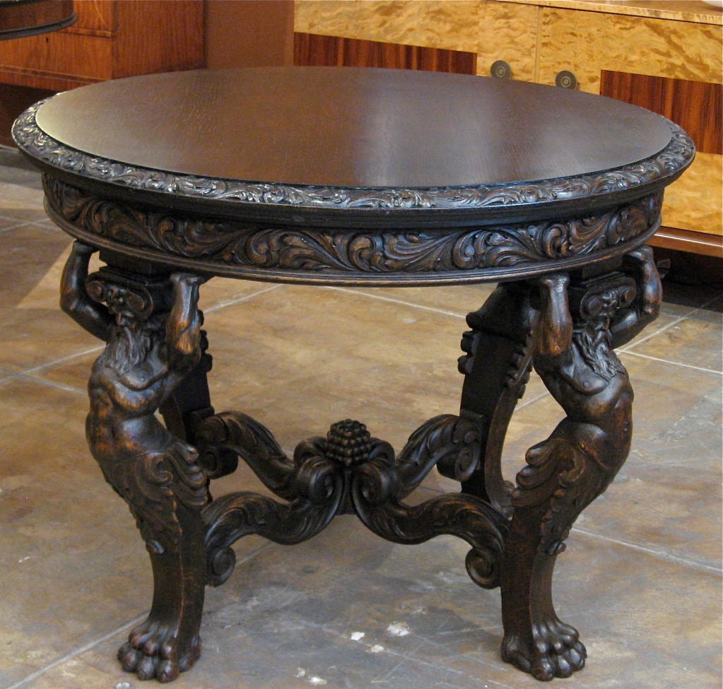 Danish Neo-Gothic (we are guessing that this is Ulysses) center table hand carved in oak. Crafted approximately ca. 1890. Plaque beneath top reads Lysberg + Hansen, Brogade, Kobenhavn.