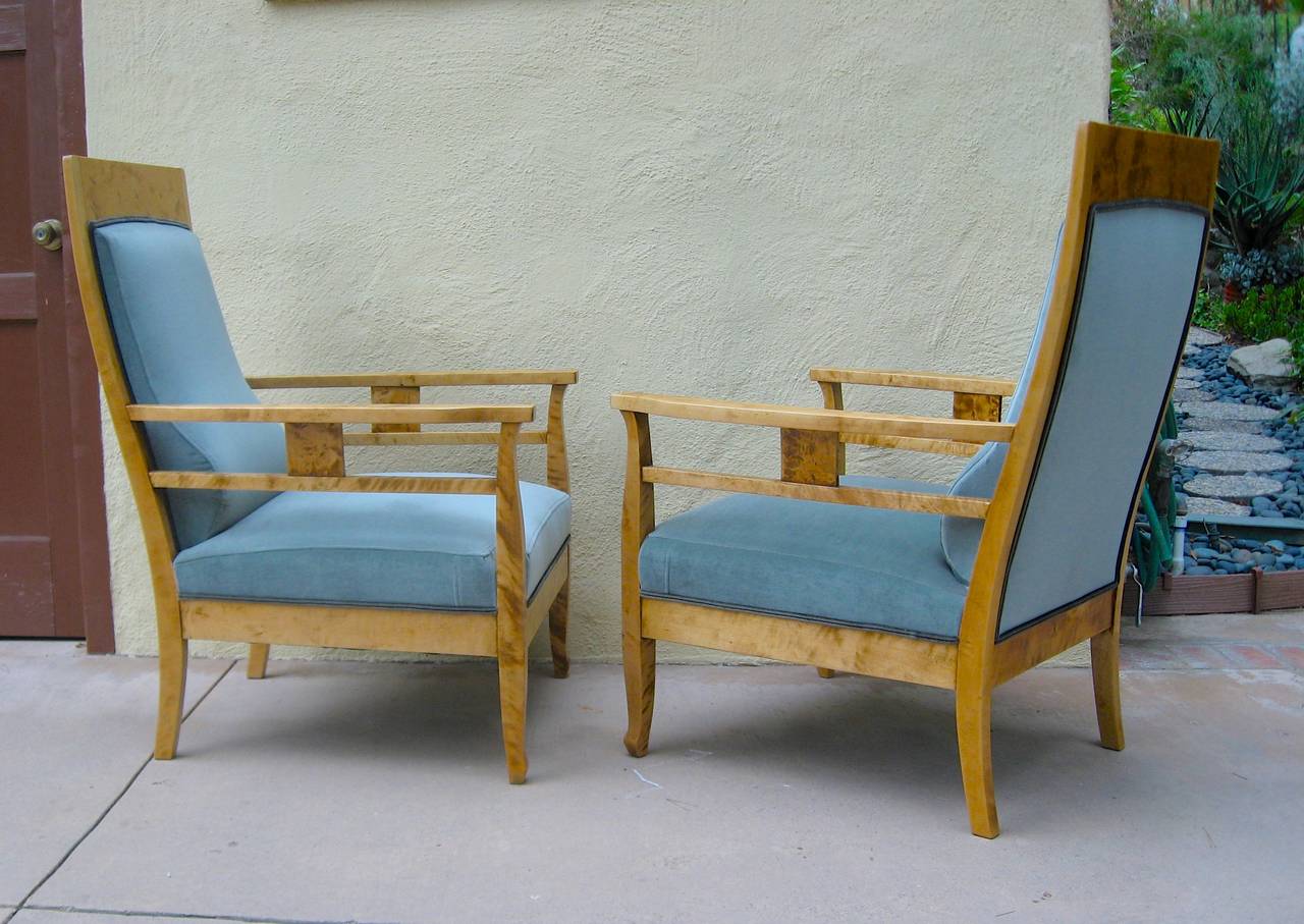 Pair of Swedish Arts & Crafts armchairs rendered in highly figured golden flame birch. Completely restored and reupholstered in high grade sea foam velvet. These are extremely comfortable.
The price listed is the FINAL NET price, which reflects a