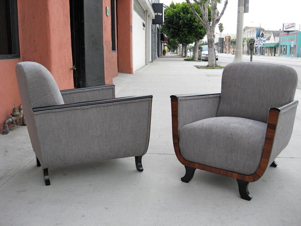 Pair of Swedish Art Deco bergeres in rosewood and ebonized birch wood. Restored and reupholstered in grey chenielle.