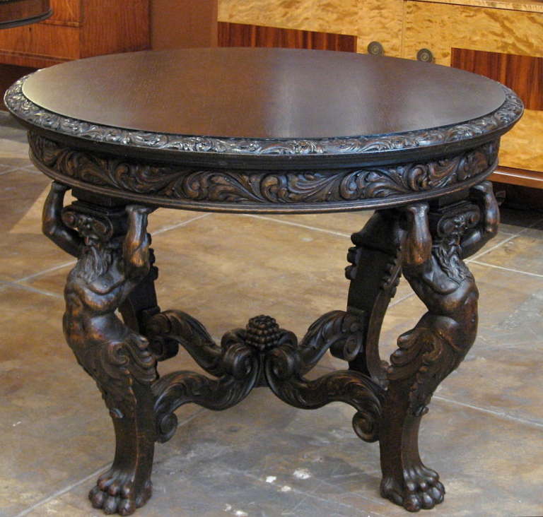 Danish Neo-Gothic (we are guessing that this is Ulysses) center table hand carved in oak. Crafted approximately ca. 1890. Plaque beneath top reads Lysberg + Hansen, Brogade, Kobenhavn.