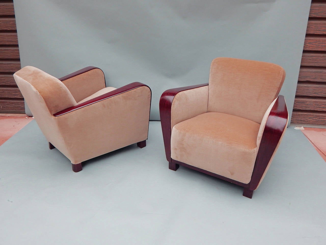 Pair of Swedish art moderne armchairs with paneled birchwood arms. Solid birchwood frames. Wood color is mid-tone brown. Restored and fresh reupholstered in taupe velvet. These are very comfortable, very solid chairs.
Unknown designer, Sweden,