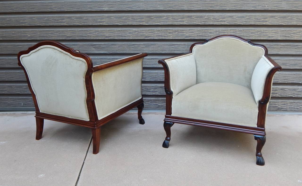 Pair of Swedish art deco armchairs in stained birch wood with ebonized leg tip  and arm  detail. Rolled crest arm. Completely restored and reupholstered in beige velvet.  The price listed is the FINAL NET price, which reflects a 50%