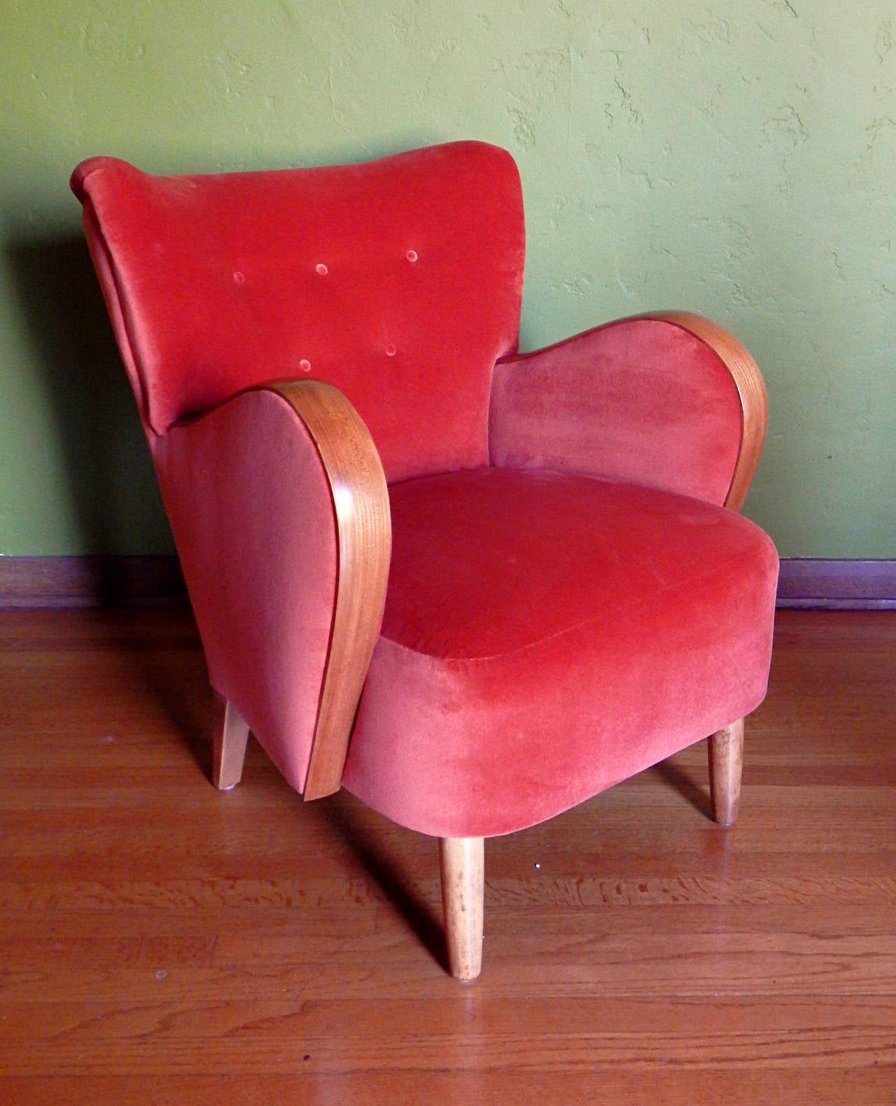 Single Swedish modernist wing-back chair, circa 1940. Tufted back with five buttons. 
Frame in solid birchwood. Arm wood is golden elm. Refinished and reupholstered in orange velvet. The price listed is the final net price, which reflects a 40%