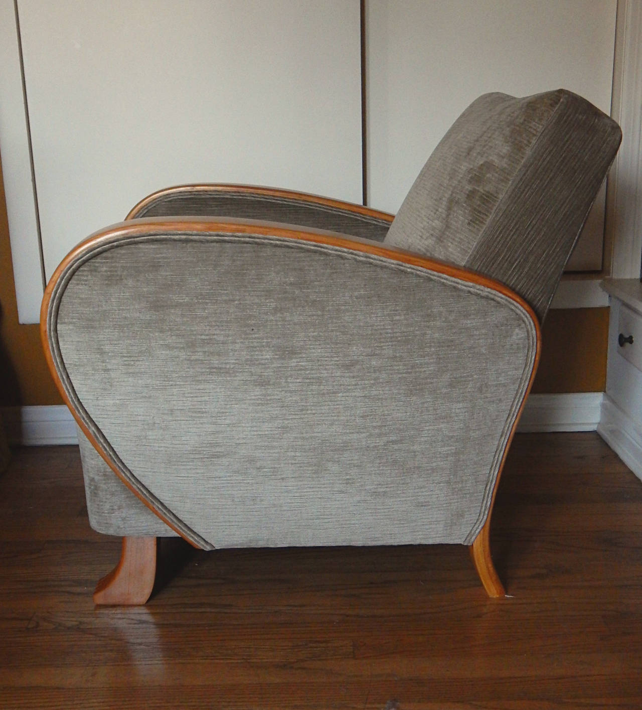 Very unusual pair of Swedish Art Deco armchairs in golden elm, circa 1930. Modernist animal feet. Frame in solid birchwood. Freshly restored and reupholstered in slivery gray velvet (see close up).  Made in Sweden, circa 1930. The price listed is