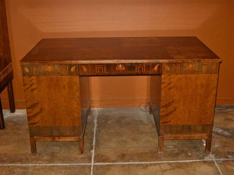 Superb Swedish Art Deco era inlaid desk-doors and top in highly figured flame birch wood-inlay in rosewood, pear and birch. four very deep golden flame birchwood drawers. Crafted under the direction of Carl Malmsten at SMF in southern Sweden circa