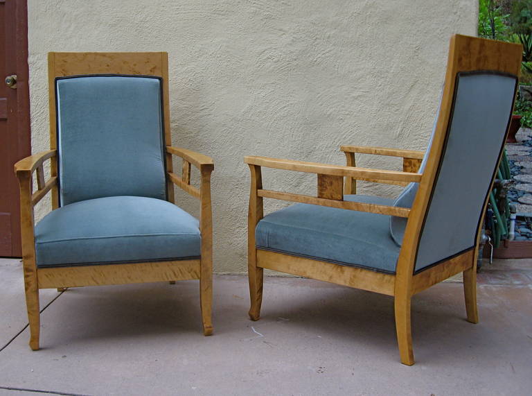 Pair of Swedish arts and crafts armchairs rendered in highly figured golden flame birch. Completely restored and reupholstered in high grade sea foam velvet. These are extremely comfortable.  The price listed is the FINAL NET price, which reflects a