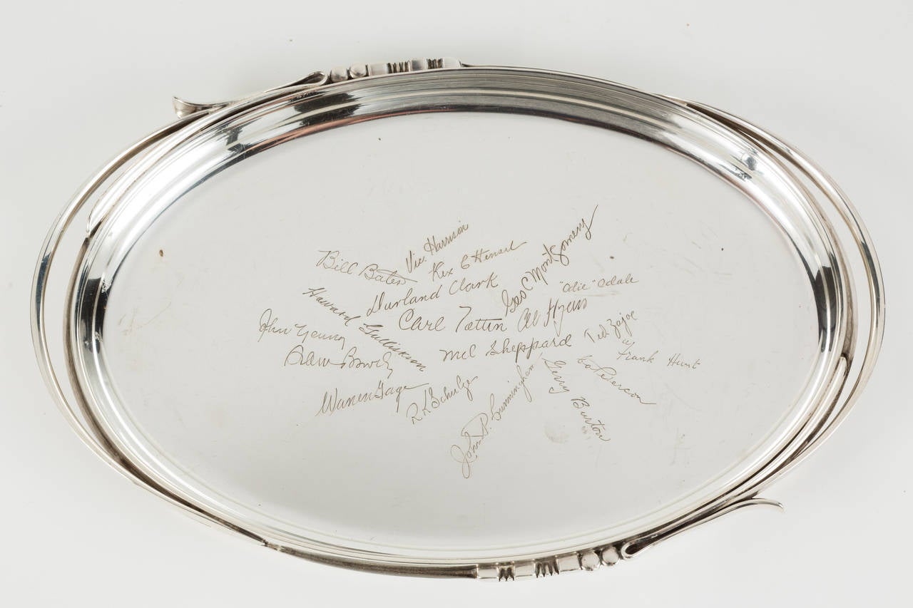 Small scale, oval sterling silver tray, designed by Alphonse La Paglia, with multiple signatures engraved. Piece features lovely ornamental handles. Back is marked: 