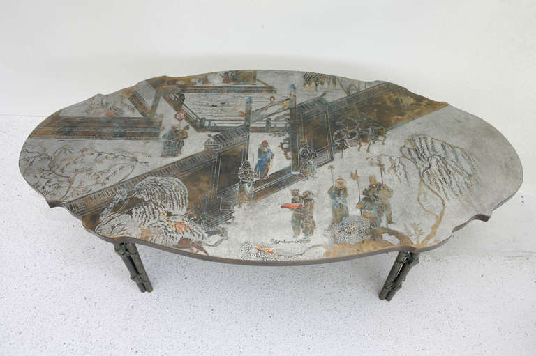 A beautiful hand sculpted cocktail table in bronze and pewter from Philip & Kelvin LaVerne's Museum Collection. Signed by the artists (see Image 3). This table has a beautiful shape and the legs are four columns 