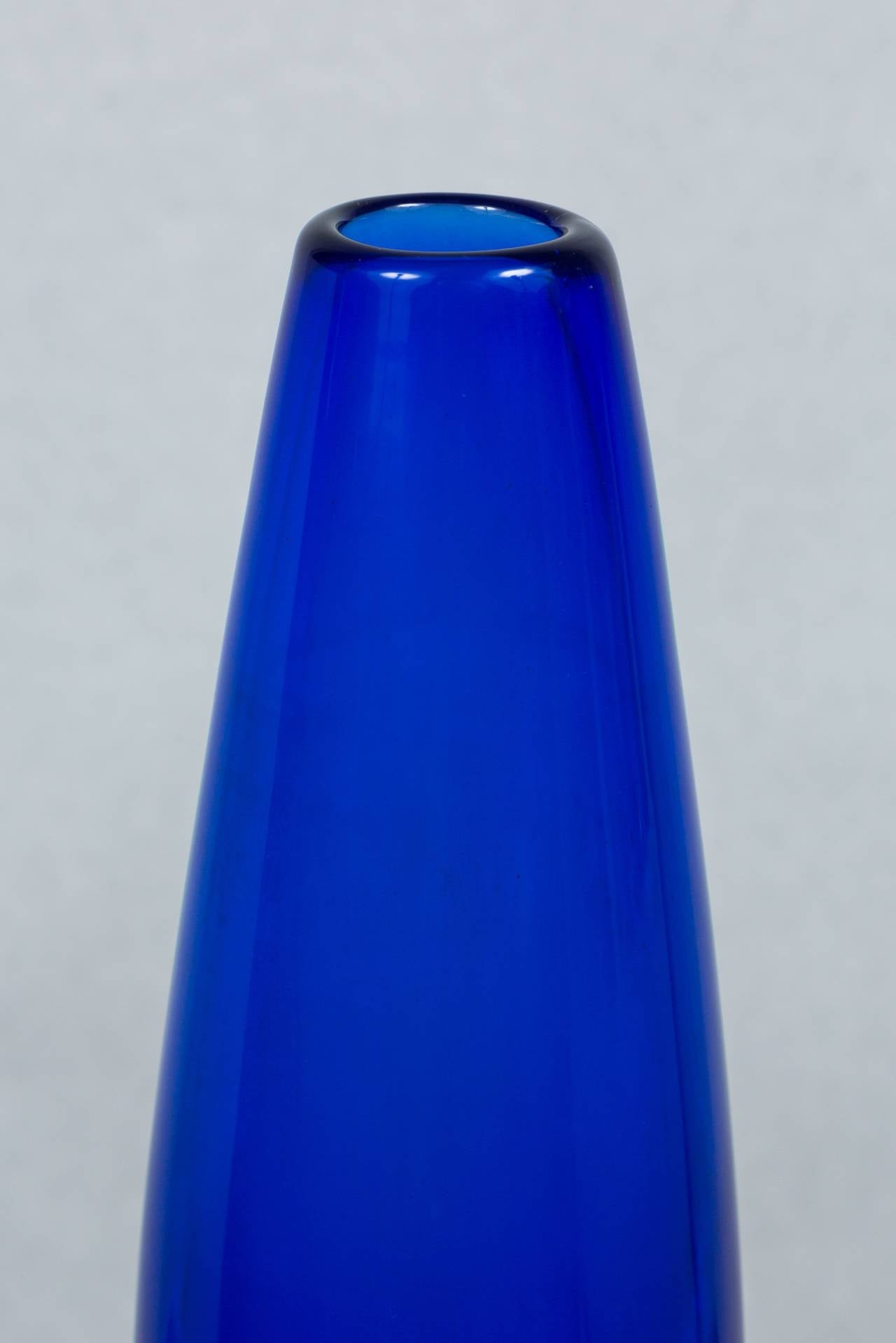 Elegant Murano Sommerso vase in a brilliant cobalt blue with purple, turquoise and clear glass. Vase is in excellent condition with the exception of some residual interior water marks from use.  Total dimensions of: 15.5