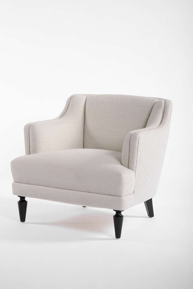 An elegant upholstered armchairs designed by William Haines for the Beverly Hills estate of Dr. Herbert & Mrs. Rita LeRoy Roedling. This deep and comfortable tight upholstered armchair has been fully restored. It has been upholstered in an oatmeal
