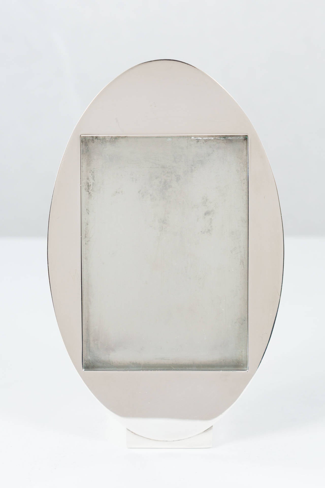 One of three available, sold individually. Elegant portrait frames by contemporary designer TsAO & McKOWN for Swid Powell. Weighted silver plate. Marked TsAO & McKOWN for Swid Powell beneath. Manufactured in Argentina.