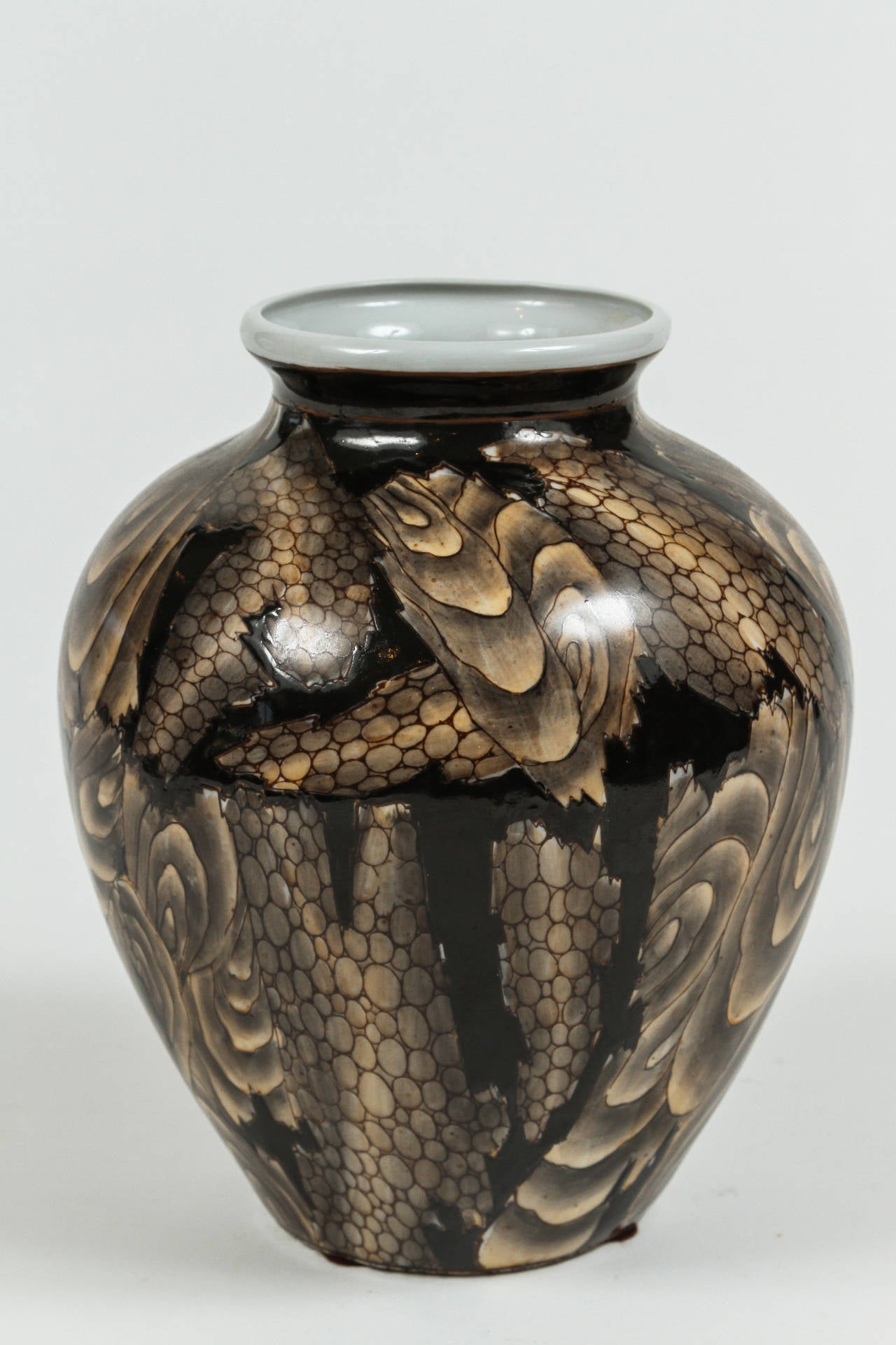 Very unique Japanese vase with abstract pattern in a variety of brown tones. The deepest brown glaze is raised, giving the vase a wonderful tactile texture.