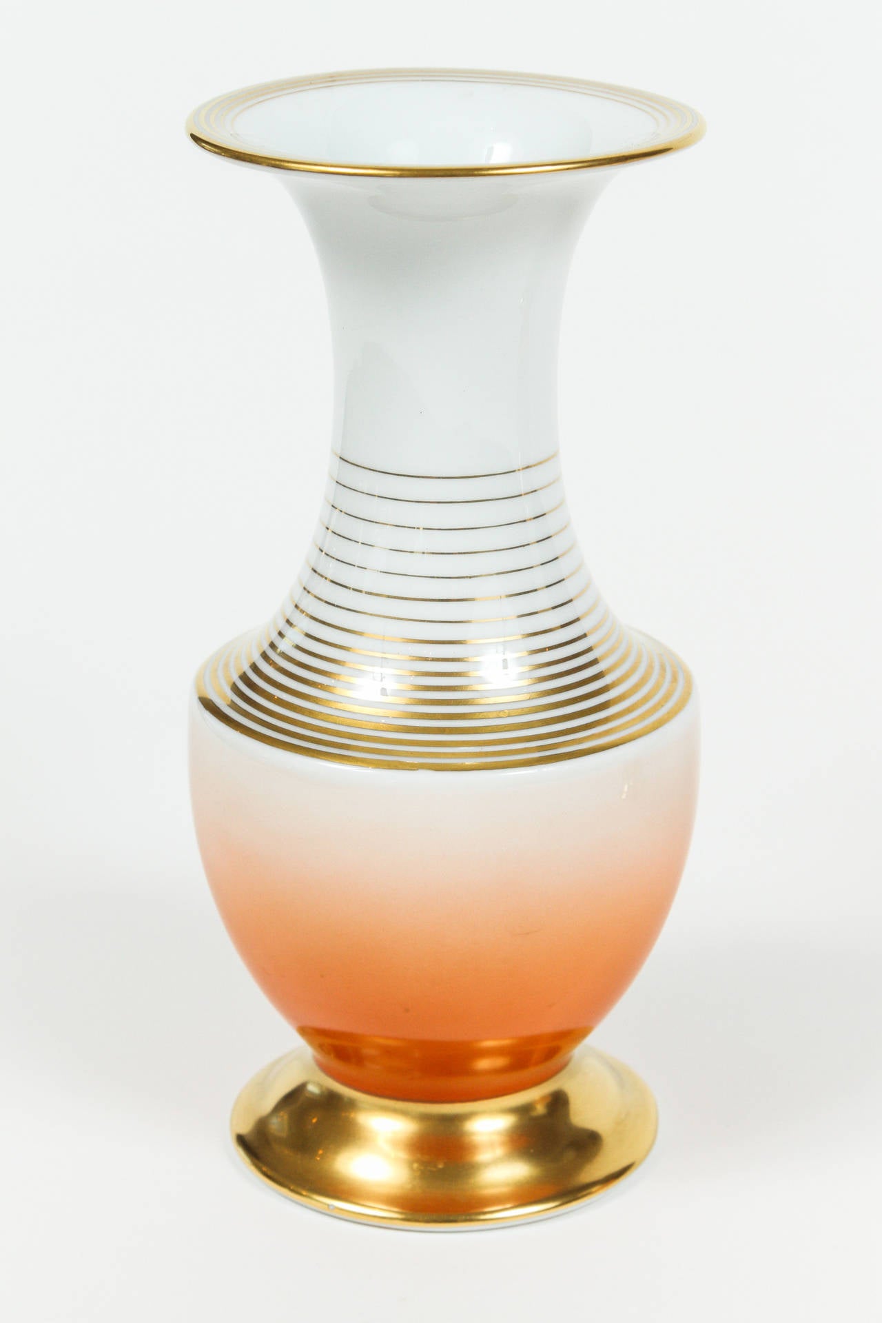 Pair of white porcelain vases by Rosenthal with painted gold rings around the top, neck and bases. Orange ombre on the bottom sections makes the vases very interesting. Printed on the underside(s): 