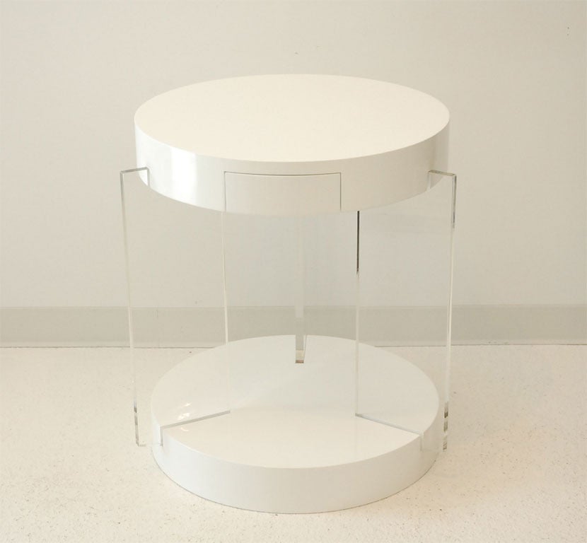 The custom order "Chicago" side table from Dragonette Private Label was inspired by the work of Samuel Marx. The lacquered top with concealed storage drawer appears to "float" above the lacquered base on three Lucite fins. Custom