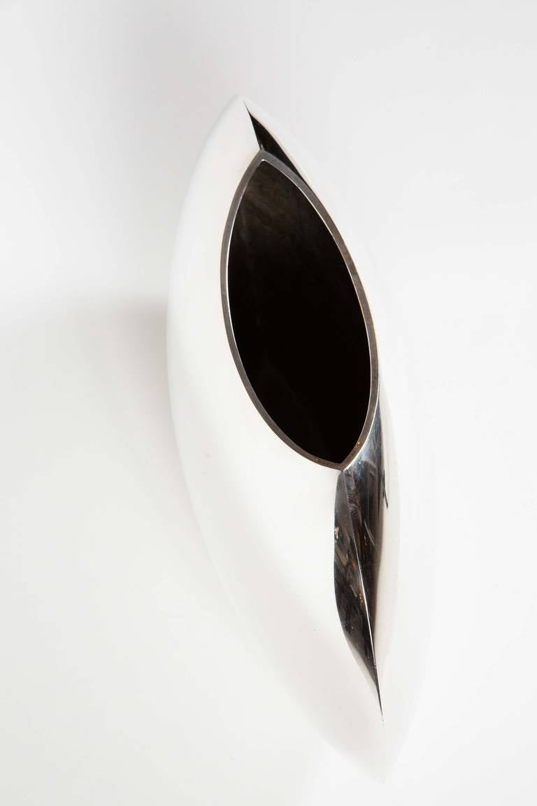 A striking elliptical silver plate vase by Lino Sabattini from his 