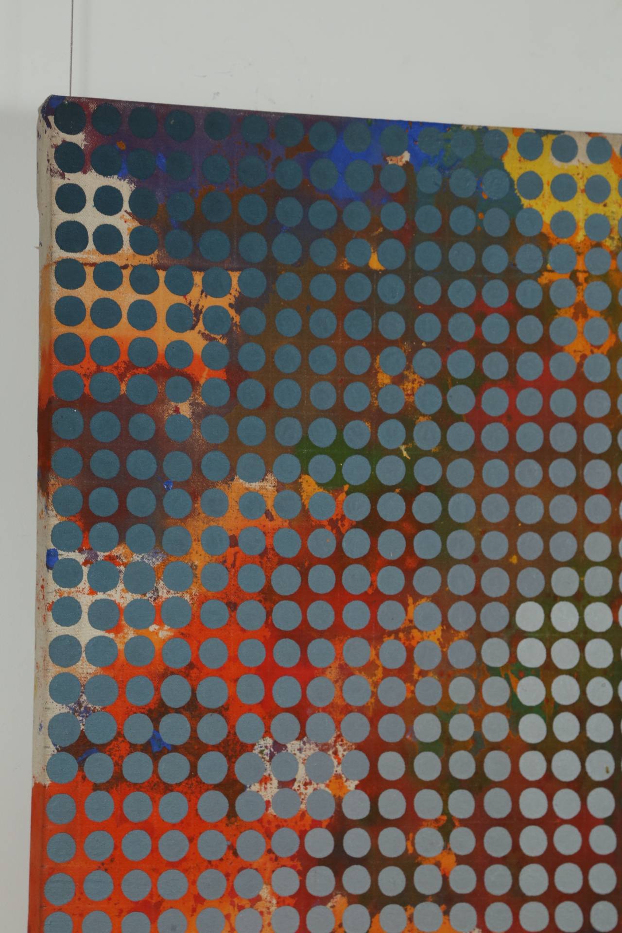 A colorful abstract painting overlaid with penny-sized dots in a color gradient from cadet blue to gray. The acrylic on canvas is signed on the back C. Swallow and dated 1971. We have two pieces by this artist, which are shown together in Image 9.