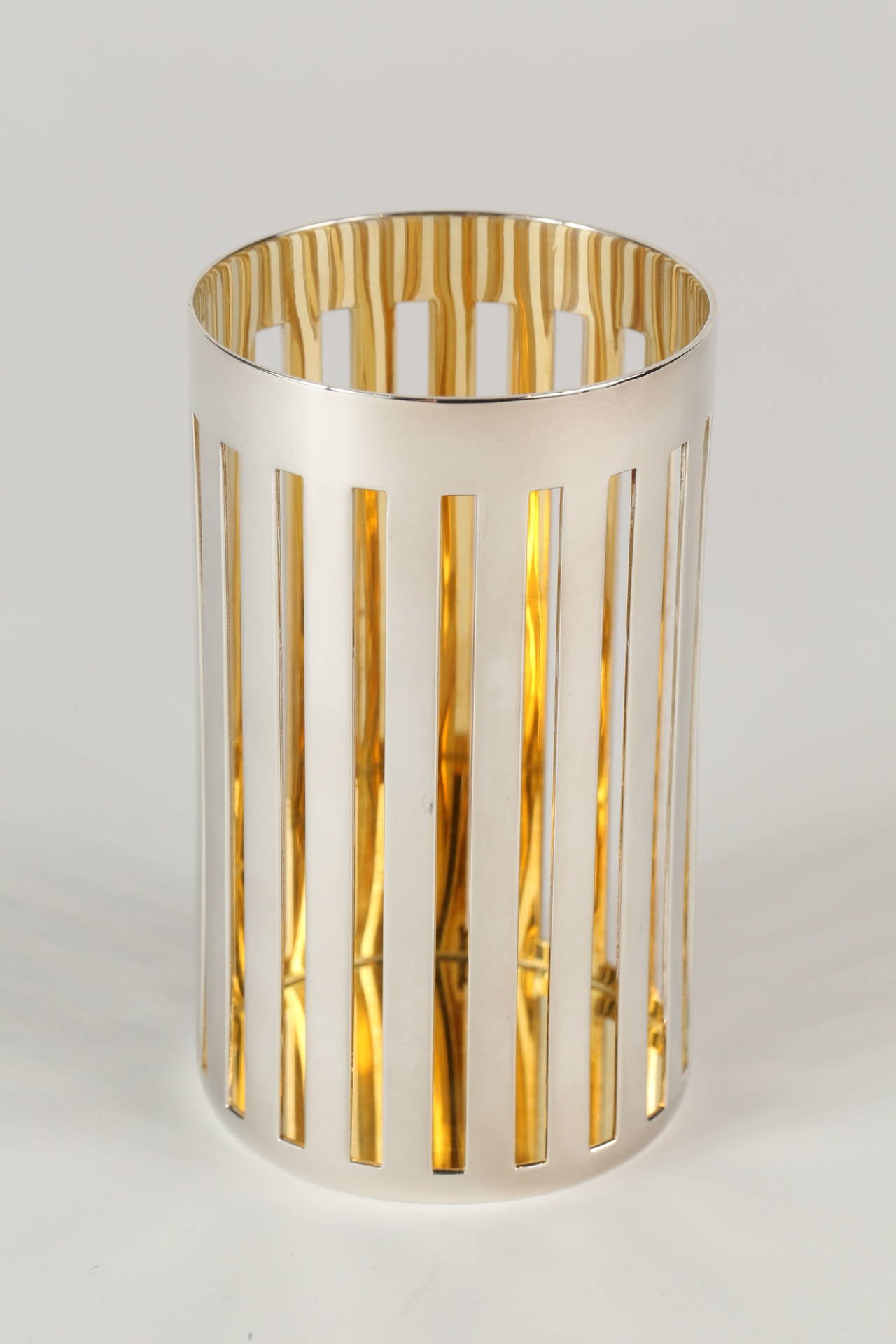 A chic Bulgari sterling silver pencil cup with a vermeil interior and cut-out details along the side. Stamped on the side 