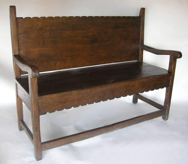 Alder wood bench with scalloped back and apron. Great distress and patina.
