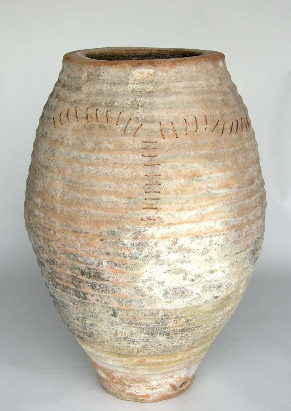 18th c. Spanish wine storage pottery vessel.  Old crack repaired with copper stitching.  Elegant classic shape.