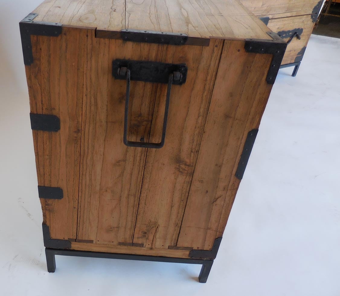Mid-19th century natural light colored kiri wood Tansus on iron bases. Hand-forged iron hardware. The drawer pulls are called 