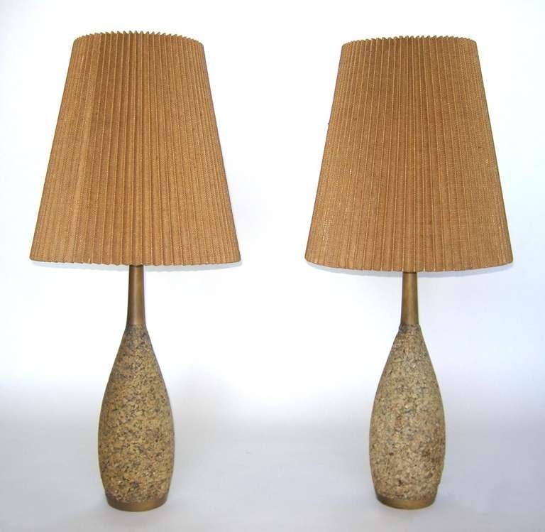 Pair of mid century cork lamps. Priced individually.
7 inch diameter at base bottom and shade is 18 inch in diameter. Total height is 42 inches.