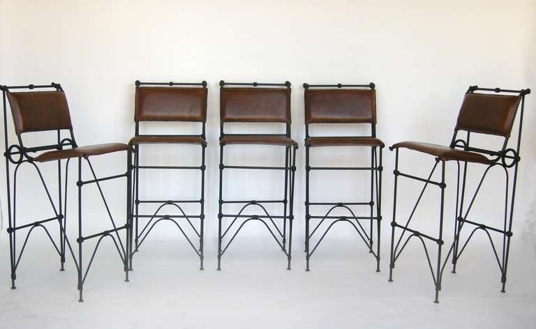 Set of five vintage bar stools by Israeli born artist and designer Illana Goor. Iron and leather. Sewn edge detail on seats