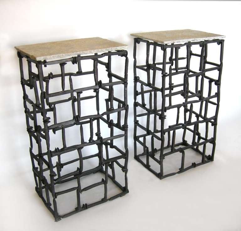 Pair of consoles/pedestals made from antique railroad spikes. Stone top.
Can be made in any size and with glass or stone top. Made in los Angeles by Dos Gallos Studio.