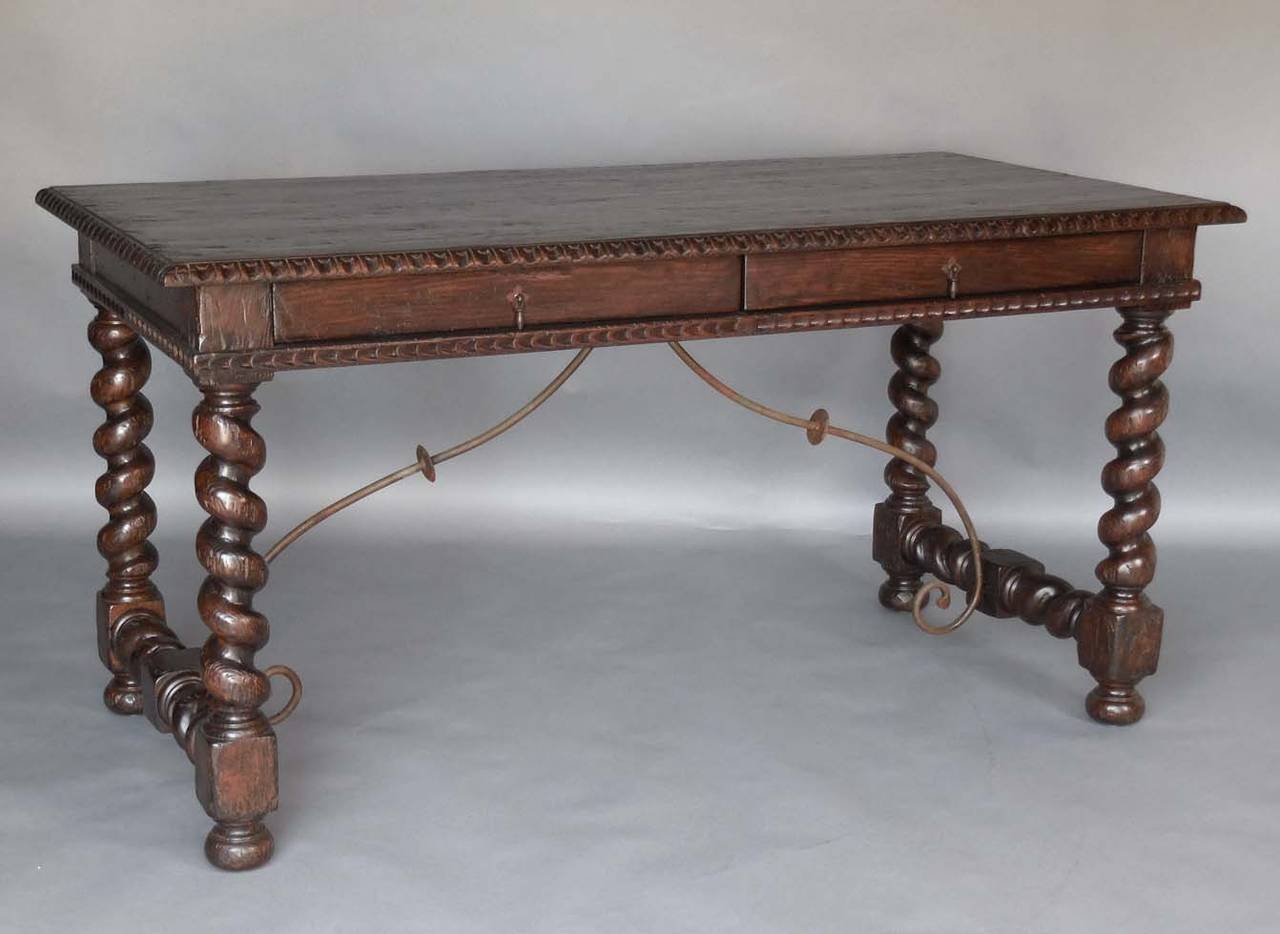 Our Custom Salamanca two-drawer oak writing desk with iron supports. Hand-carved details throughout. Iron pulls. Beautiful patina. Can be made in any size, and finish. Can also be making in walnut and mahogany. Bench made in Los Angeles by Dos