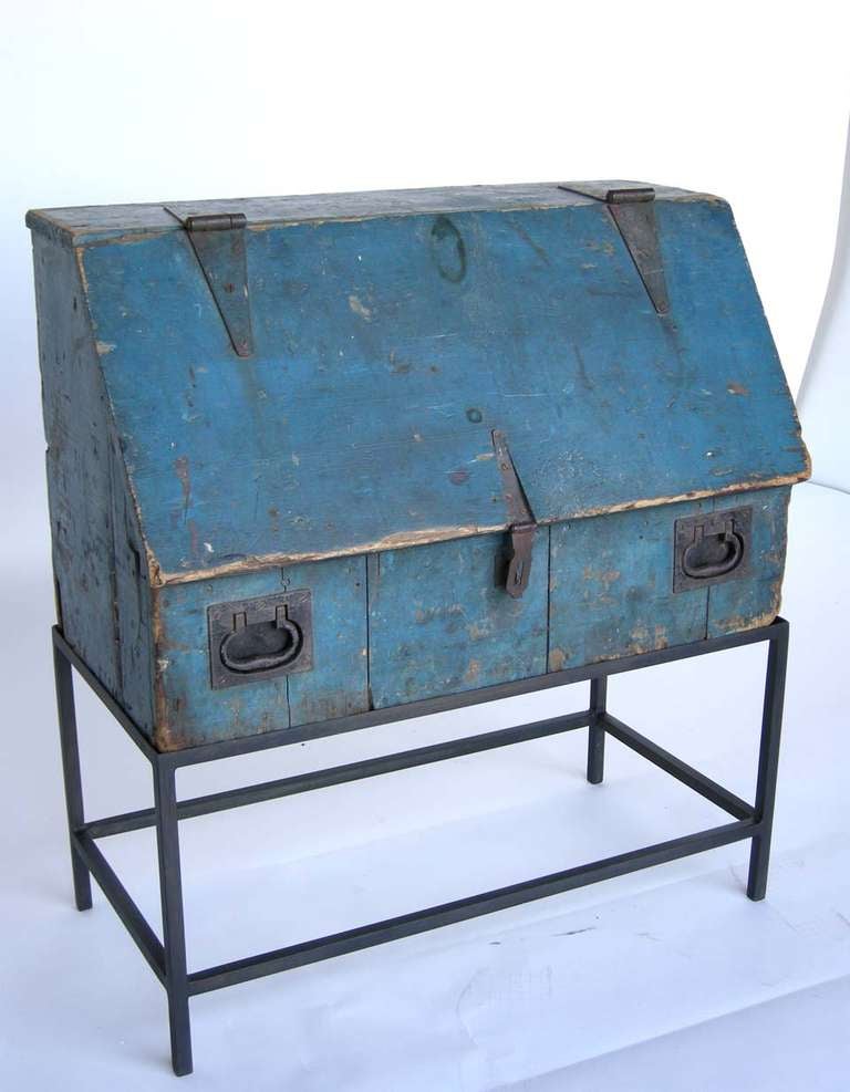 Early 20th c painted blue wooden tool chest with drawers and shelves inside. Atop hand forged iron base. New England

