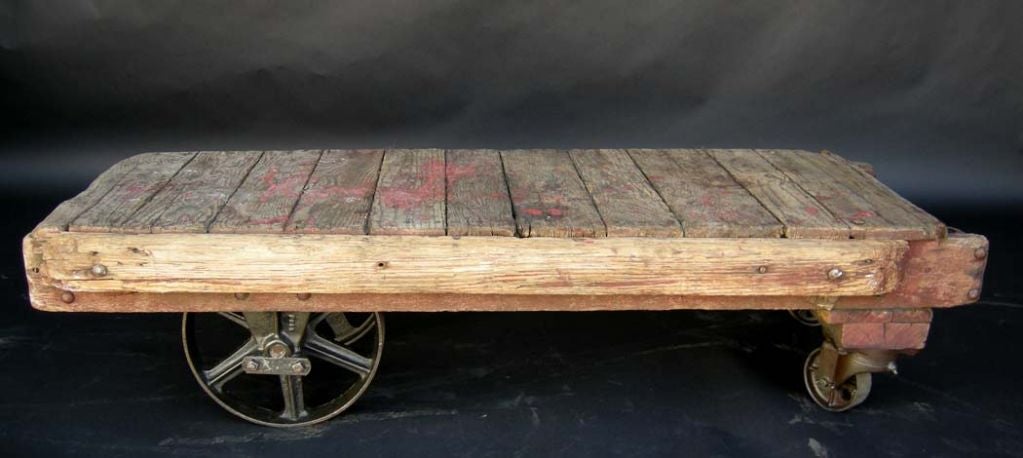 Early 1900's wooden cart , all original, with steel wheels. Some paint remnants