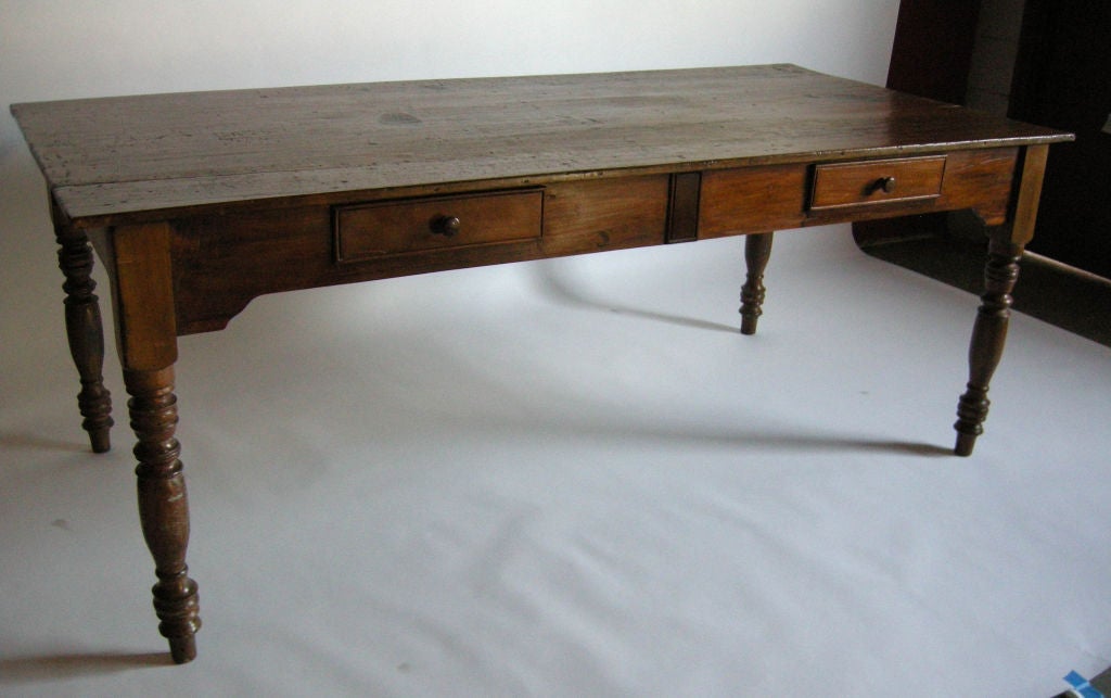 19th c. cedro wood table with two drawers on either side. Three wide board top.
FOR OUR COMPLETE INVENTORY PLEASE GO TO www.dosgallos.com
