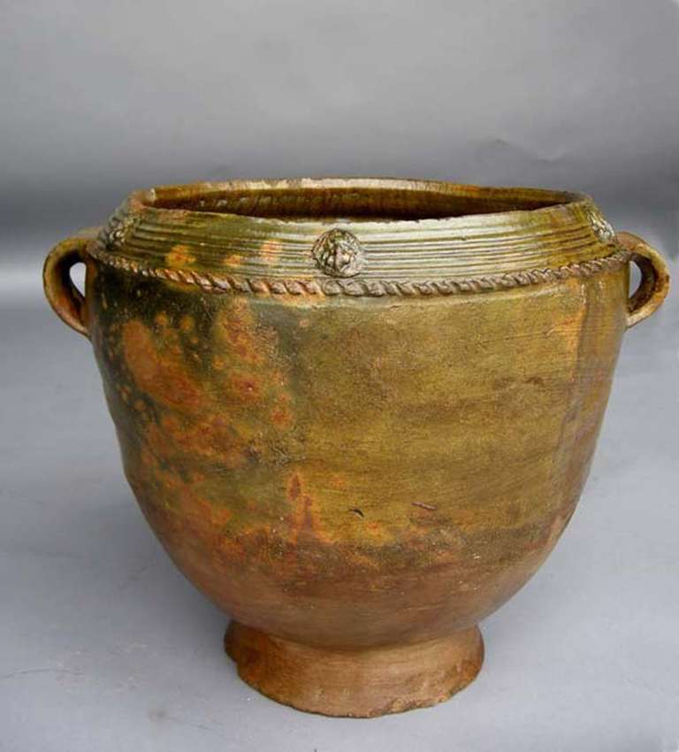 Antique ceramic olla (water pot) with lovely green glaze, relief and medallions decoration. Handles are in great condition.