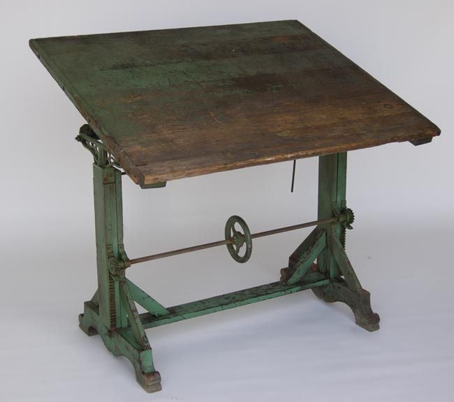 Early 20th American adjustable wooden drafting table with green paint. Great patina! Works really well!
FOR OUR COMPLETE INVENTORY PLEASE GO TO www.dosgallos.com