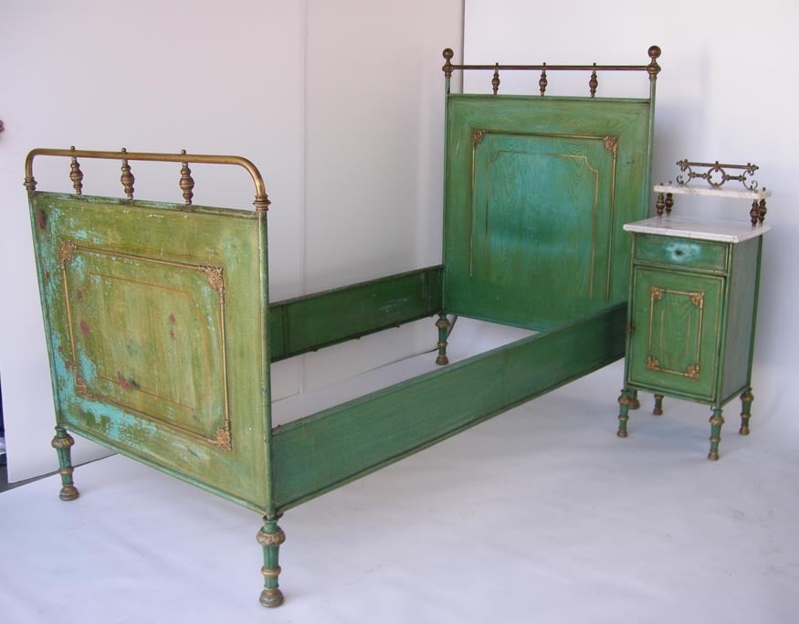Pair of beautiful antique French metal twin beds painted in a green faux bois style. NIGHTSTANDS ARE SOLD! Details are in brass over copper. 
FOR OUR COMPLETE INVENTORY PLEASE GO TO www.dosgallos.com