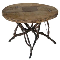 Antique Wooden Wheel and Iron Table