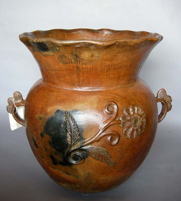 Antique ceramic florero  - flower pot  - with flared pie crust opening and flower reliefs. Applied floral motif, orange, sienna glaze. 
