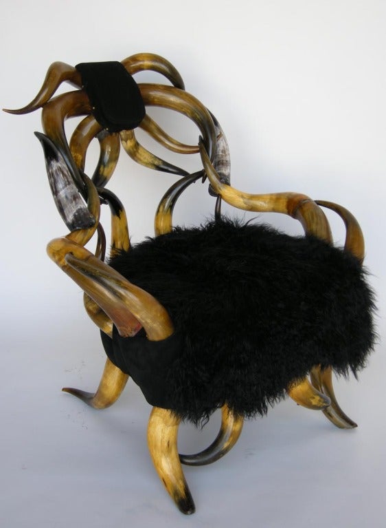Victorian striking Texas horn chair, newly upholstered in black suede, two Mongolian lamb throws included (only one shown in photo).
TO SEE OUR COMPLETE INVENTORY, PLEASE VISIT www.dosgallos.com
