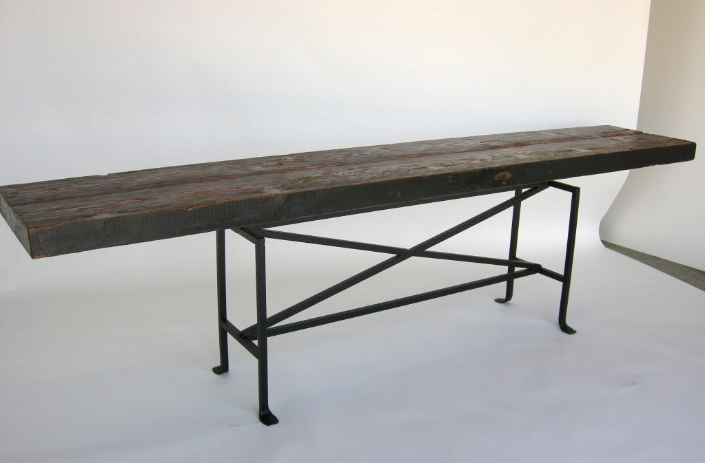 Wood console with hand forged base. Shown here in a built up top in Douglas fir, approximately 3.5