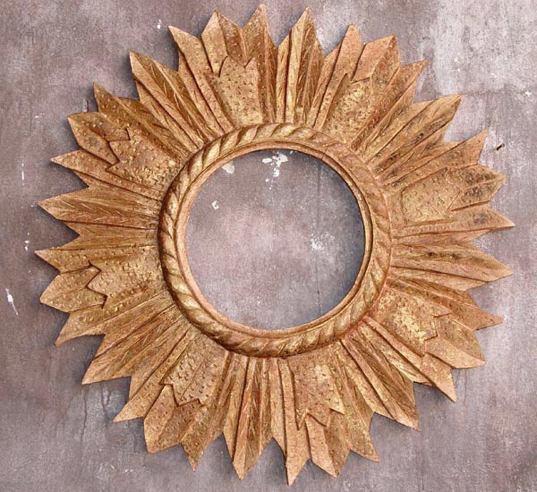 Hand-carved and hand finished star burst mirror frame. Price includes regular mirror glass. Gold and red tones.