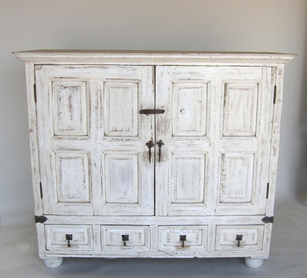 Cipres wood painted cabinet with one interior shelf and four drawers. Hand forged iron.