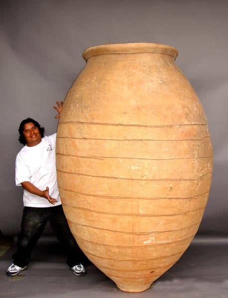 Very large 18-19th c. Castillian wine storage pots originally buried underground. Has rope in print in terracotta. One is in almost perfect condition and the other has been repaired in many places. Buy one and get one for free. Price listed is for