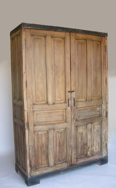 Antique door armoire with hand forged iron banding. Large scale and rustic style. Interior depth 22 inches
