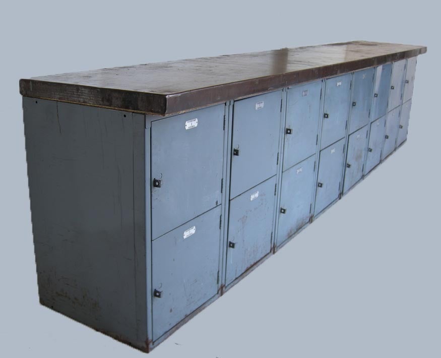 Console consisting of four vintage metal lockers and steel top. 
