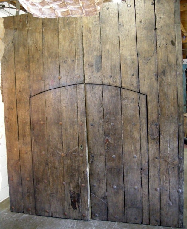 Huge 19th c. portons - large doors with smaller doors. Totally functional and great looking. large iron clavos, nails, throughout, original hardware
9'3 inches x 4.5 inches thick x 10'10 inchesH