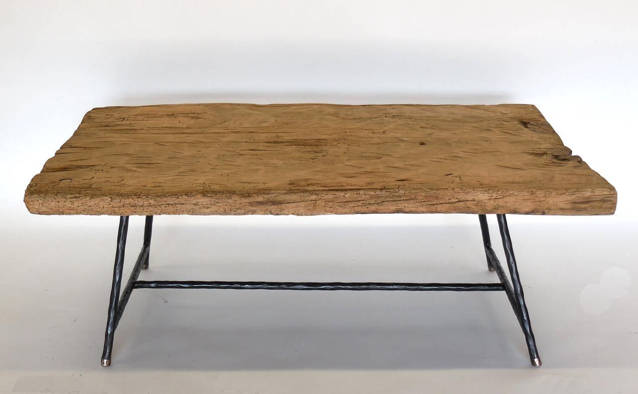 Antique one wide board batea (wooden tray) table with contemporary hand-forged legs with bronze tip legs. Great old natural patina, hand hewn top.